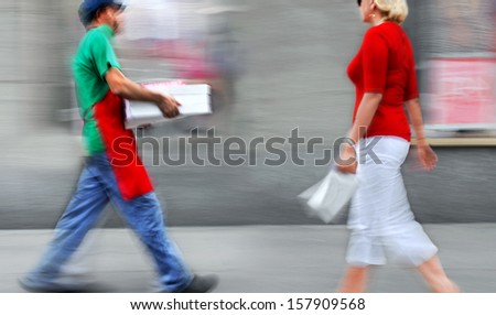 lunchtime, delivery food and drink by hand, purposely motion blur