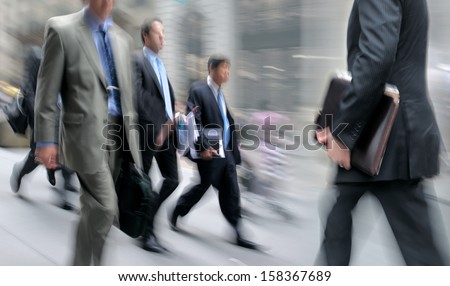 Business People At Rush Hour Walking In The Street, In The Style Of Motion Blur
