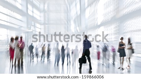 Abstakt Image Of People In The Lobby Of A Modern Business Center With A Blurred Background