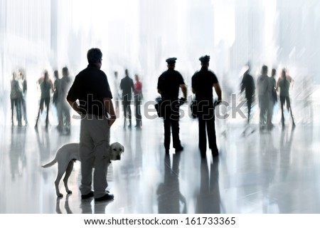 Abstakt Image Of People And Security Guard With A Dog In The Lobby Of A Modern Business Center With A Blurred Background