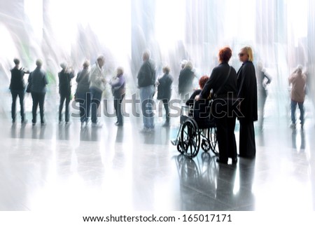 group and disabled people in the lobby business center