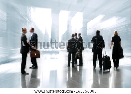 abstakt image of people in the lobby of a modern business center with a blurred background