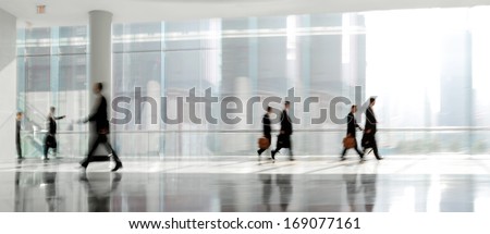 abstrakt image of people in the lobby of a modern business center with a blurred background