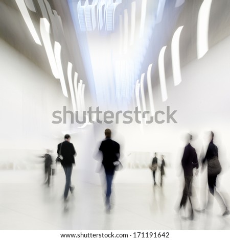 Abstakt Image Of People In The Lobby Of A Modern Art Center With A Blurred Background