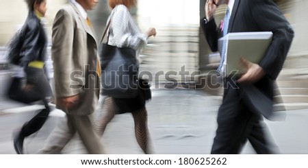 abstrakt image of business people in the street and modern style with a blurred background