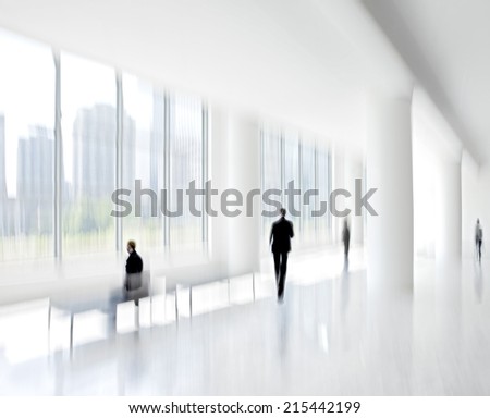 abstract image of people in the lobby of a modern business center with a blurred background