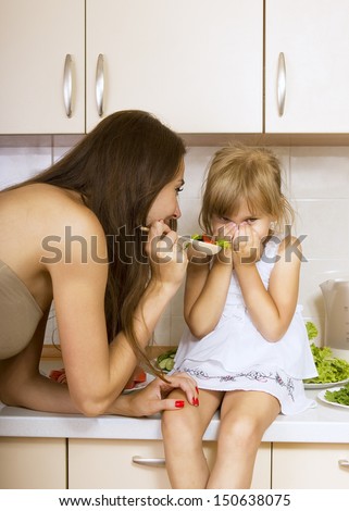 girl with no appetite - kid does not want to eat salad