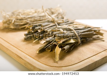 White willow bark medical herb isolated on white background, used in herbal medicine. Salix alba