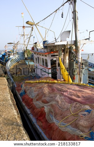 GOKARNA,INDIA - Feb 27: Indian fishing boat, India on Feb 27, 2014. In India poor people usually engaged in Fishing. Many people use the same old equipment, inherited from their ancestors
