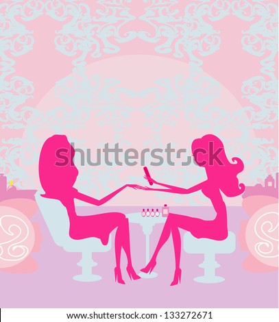 Young lady doing manicure in beauty salon