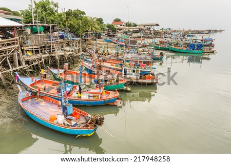 Phetchaburi -  September 7 : Fishing boats stand in the harbor to transport fish from the boats to the market  which 90% of  foreign workers is Burmese. September 7, 2014  Phetchaburi Thailand.