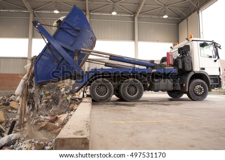 Removal of waste to the incinerator, truck dumps waste