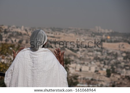 JERUSALEM - OCT 31: Ethiopian Jewish woman prays, facing the old city, at the Sigd - Oct. 31, 2013 in Jerusalem, Israel. The Sigd is an annual holy day of the Ethiopian Jews.
