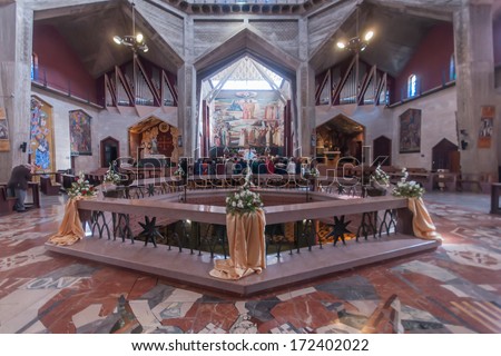 NAZARETH, ISRAEL - JAN 07, 2014: A group of pilgrims pray in the Church of the Annunciation, in Nazareth, Israel