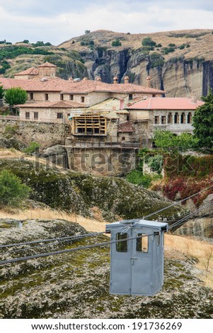 A monastery and a typical cable car in Meteora, Greece