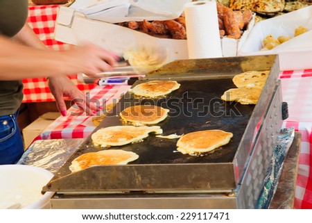 Pancakes preparation in a French market, in place du Marche square, in Bastia, Corsica, France