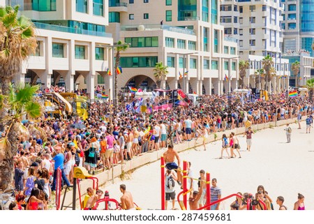 TEL AVIV, ISRAEL - JUNE 12, 2015: View of the beach of Tel-Aviv, and the crowd Pride Parade participants in Tel-Aviv, Israel. Its part of an annual event of the LGBT community