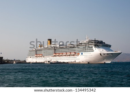 KOS, GREECE - SEPTEMBER 08: Costa Atlantica Cruise ship anchored in the port of Kos Town on September 08, 2012. The Ship Company provide cruise holidays in all the world.