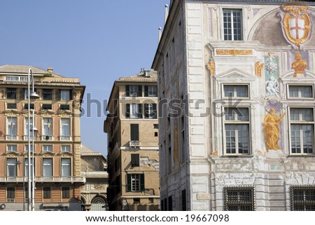 Painting on San Giorgio Palace  facade, Genoa. Caricamento square,antique buildings near the old harbour, Italy