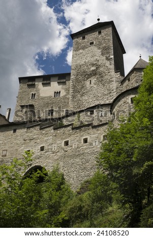 Tures Castle and cloudy sky. Medieval castle at the entrance to the Aurina Valley, South Tyrol Italy