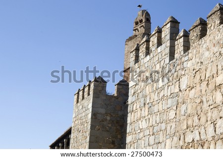 Stork on the Avila city walls. Medieval wall battlements.  Avila old city is a UNESCO World Heritage Site - Spain