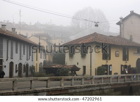 Foggy day in Milan - Italy Characteristic house of old town.The Naviglio Grande was the first artificial canal in Europe - Lombardy