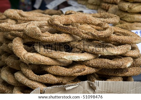 Koulouri a circular Greek bread with sesame seeds. Are often sold by street vendors.  They are similar to Turkish bread \