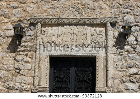 Areopoli - Relief carvings over the door of Taxiarches church.  Areopoli is the capital of the Deep Mani Peninsula - Peloponnese, Greece