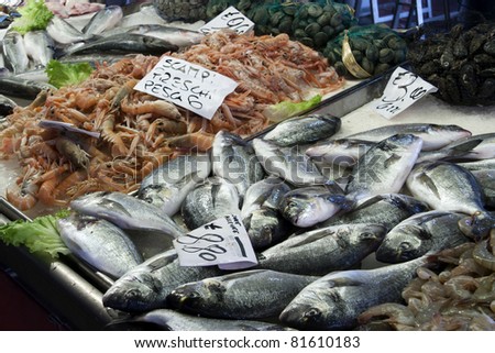 Venetian fish market - Gilthead bream and prawns. The Rialto fish market is located alongside the Grand Canal near the Rialto Bridge - Venice, Italy