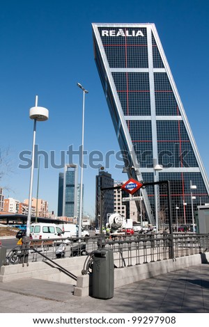 MADRID - MARCH 9: Plaza de Castilla Metro entrance on March 9, 2012 in Madrid, Spain. In background Puerta de Europa tower, 115 m tall, first inclined skyscrapers in the world