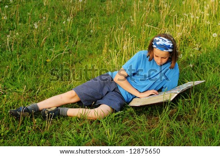 portrait of girl reading outside