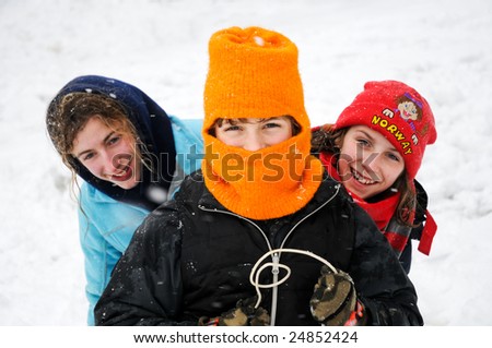 closeup of children laughing on sledge