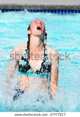 portrait of young female in swimming pool