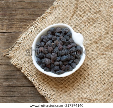 Dried black chickpea on a wooden table