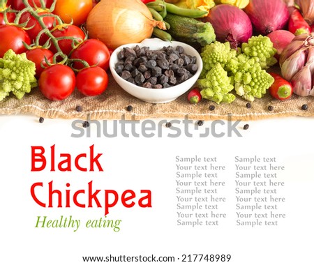 Black chickpea in a bowl with vegetables isolated on white