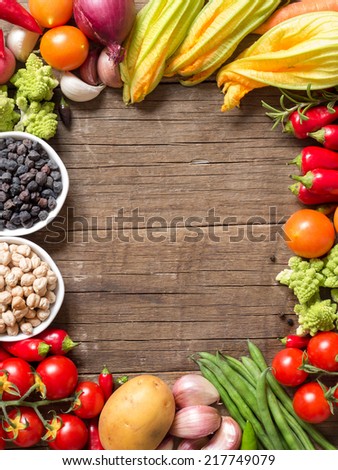Vegetables and chickpea on a wooden table  background