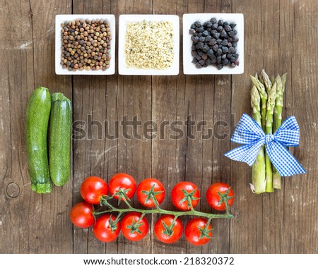 Roveja, hemp seeds, black chickpea and vegetables on a wooden table