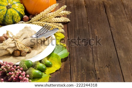 Rustic autumn table setting on wooden table