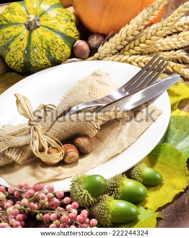 Rustic autumn table setting on wooden table