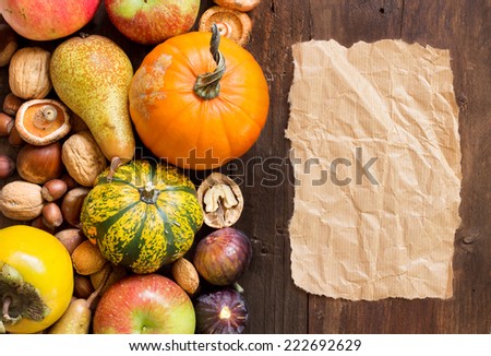 Autumn border and paper  on a wooden table