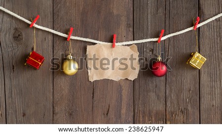 Blank paper card and christmas decor hanging on rope