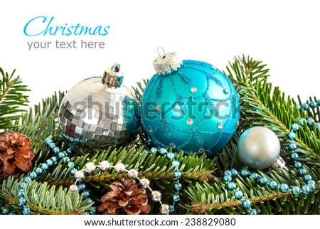 Turquoise and silver Christmas ornaments border on white background