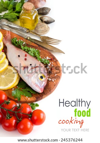 Fresh fish on a wooden board isolated on white