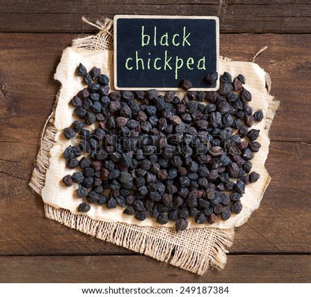 Pile of Black Chickpea  with a small chalkboard