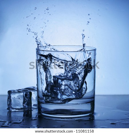 Ice splashing into a glass.