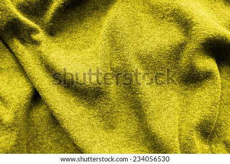 Yellow creased fabric background