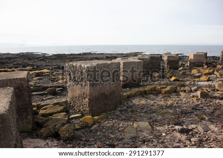Old war tank defences on the beach. Large concrete blocks, Scotland