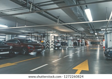 Modern underground parking garage, toned with copy space