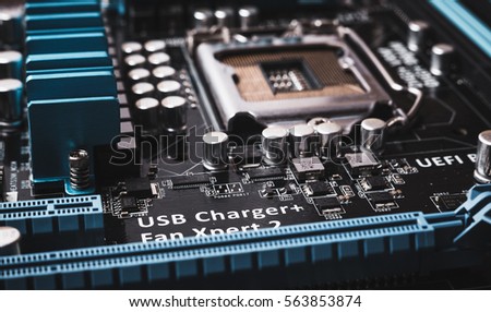 Printed Circuit Board with many electrical components. Close up image. Technology and hardware electronic concept