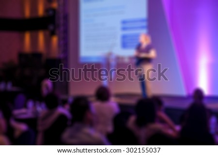 blurred women with projection screen -  conference Room
